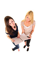 Image showing Two beautiful student girls getting ready for school