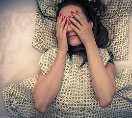 Image showing Young woman in the bed