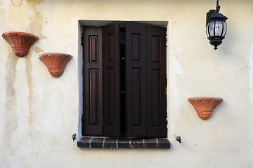 Image showing Window With Brown Shutters