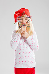 Image showing Happy young girl holding Christmas star decoration