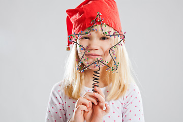 Image showing Happy young girl holding Christmas star decoration