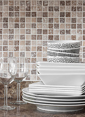 Image showing White dishes and plates on kitchen countertop