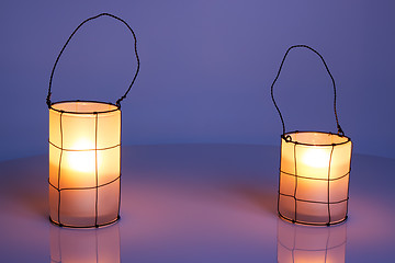 Image showing Two cozy lanterns in twilight