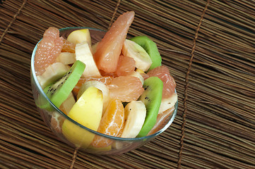 Image showing Fruit salad with citrus in a glass bowl