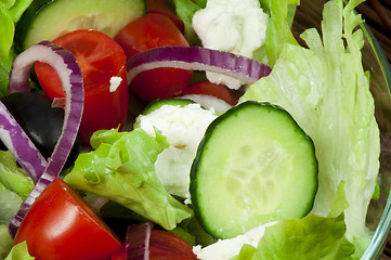 Image showing Salad in a glass bowl close up. 