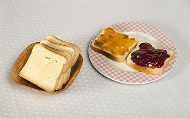 Image showing Spread jam on bread