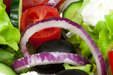 Image showing Salad in a glass bowl close up. 