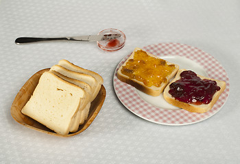 Image showing Spread jam on bread