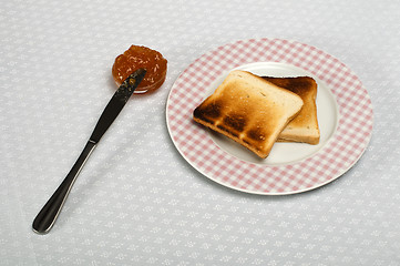 Image showing Slice of bread spread with jam
