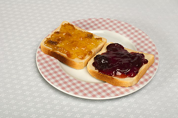 Image showing Spread jam on bread