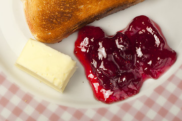 Image showing Jam, butter and toast.