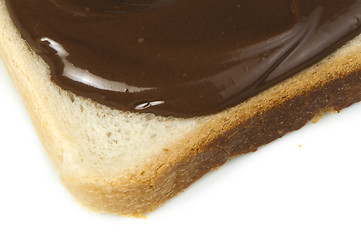 Image showing Liquid chocolate on a slice of bread