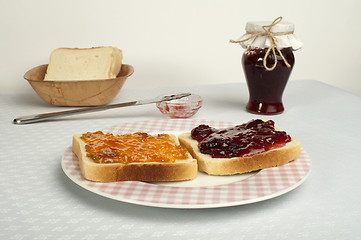 Image showing Spread jam on bread