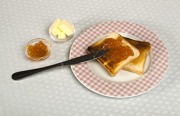 Image showing Spread jam on bread