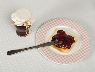 Image showing Spread jam on bread