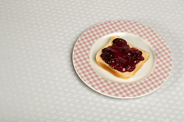 Image showing Spread jam on bread