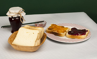 Image showing Spread jam on bread