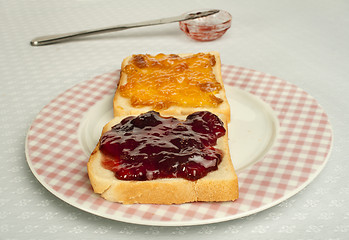 Image showing Spread jam on bread