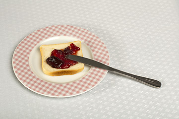 Image showing Spread jam on bread