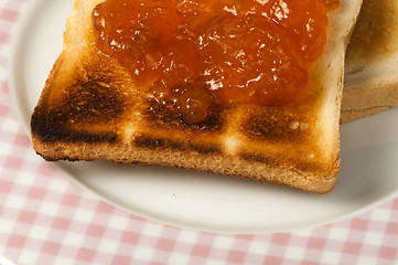 Image showing Spread jam on bread