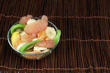 Image showing Fruit salad with citrus in a glass bowl