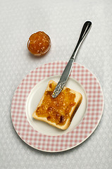 Image showing Spread jam on bread