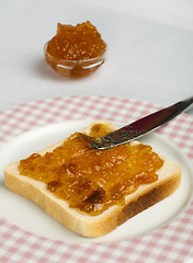 Image showing Spread jam on bread