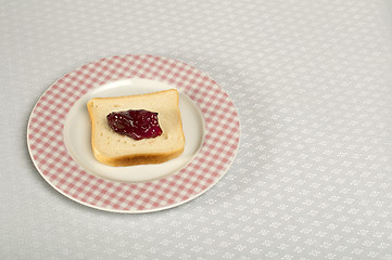 Image showing Spread jam on bread