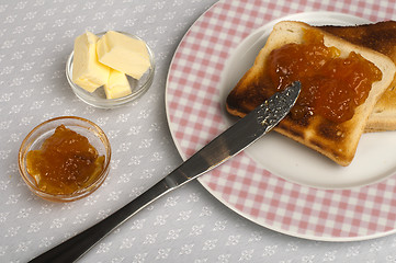 Image showing Spread jam on bread