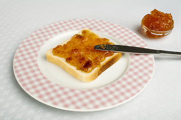 Image showing Spread jam on bread