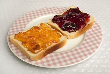 Image showing Spread jam on bread