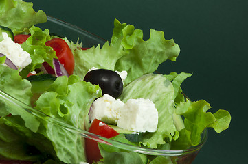 Image showing Salad in a glass bowl close up. 