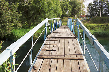 Image showing The bridge over the river in a provincial town