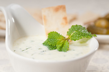 Image showing Greek Tzatziki yogurt dip and pita bread