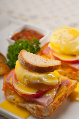 Image showing eggs benedict on bread with tomato and ham