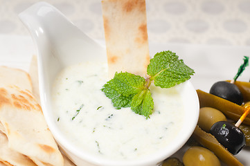 Image showing Greek Tzatziki yogurt dip and pita bread