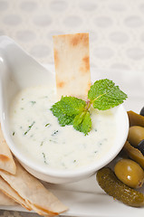 Image showing Greek Tzatziki yogurt dip and pita bread