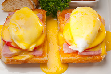 Image showing eggs benedict on bread with tomato and ham