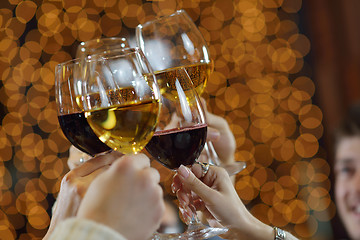 Image showing Hands holding the glasses of champagne and wine