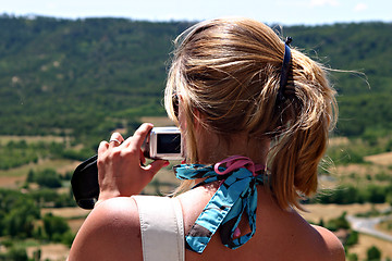 Image showing Blonde woman with digital camera