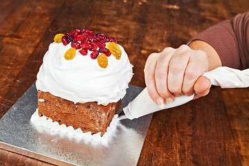 Image showing Christmas cake pastry bag decoration