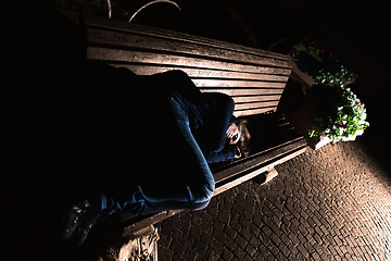 Image showing Homeless girl on the bench