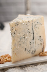 Image showing gorgonzola cheese fresh cut and pinenuts