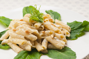 Image showing Italian pasta penne gorgonzola and pine nuts