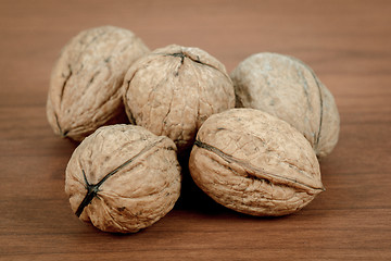 Image showing walnuts on wooden background