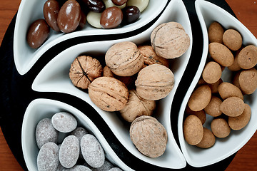 Image showing detail of almonds in chocolate and walnuts