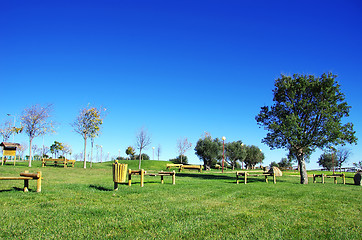 Image showing Wooden chairs in portuguese park