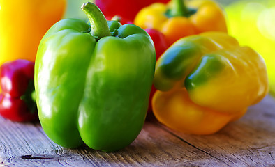 Image showing yellow, red, green peppers on table