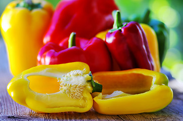 Image showing red, yellow and green pepper on table