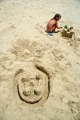 Image showing Building castle in the sand